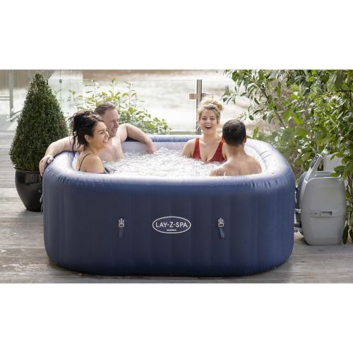 Four adults in a Hawaii Hot Tub available to hire from Kingdom of Castles in Aldershot