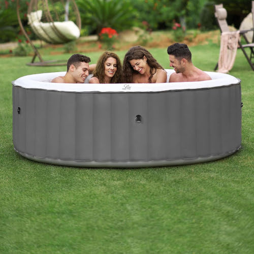 Two couples in an mSpa 6 person hot tub available to hire from Kingdom of Castles in Farnborough